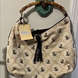 Cream and Brown Monkey Pattern Hobo Bag was stored was a little dirty